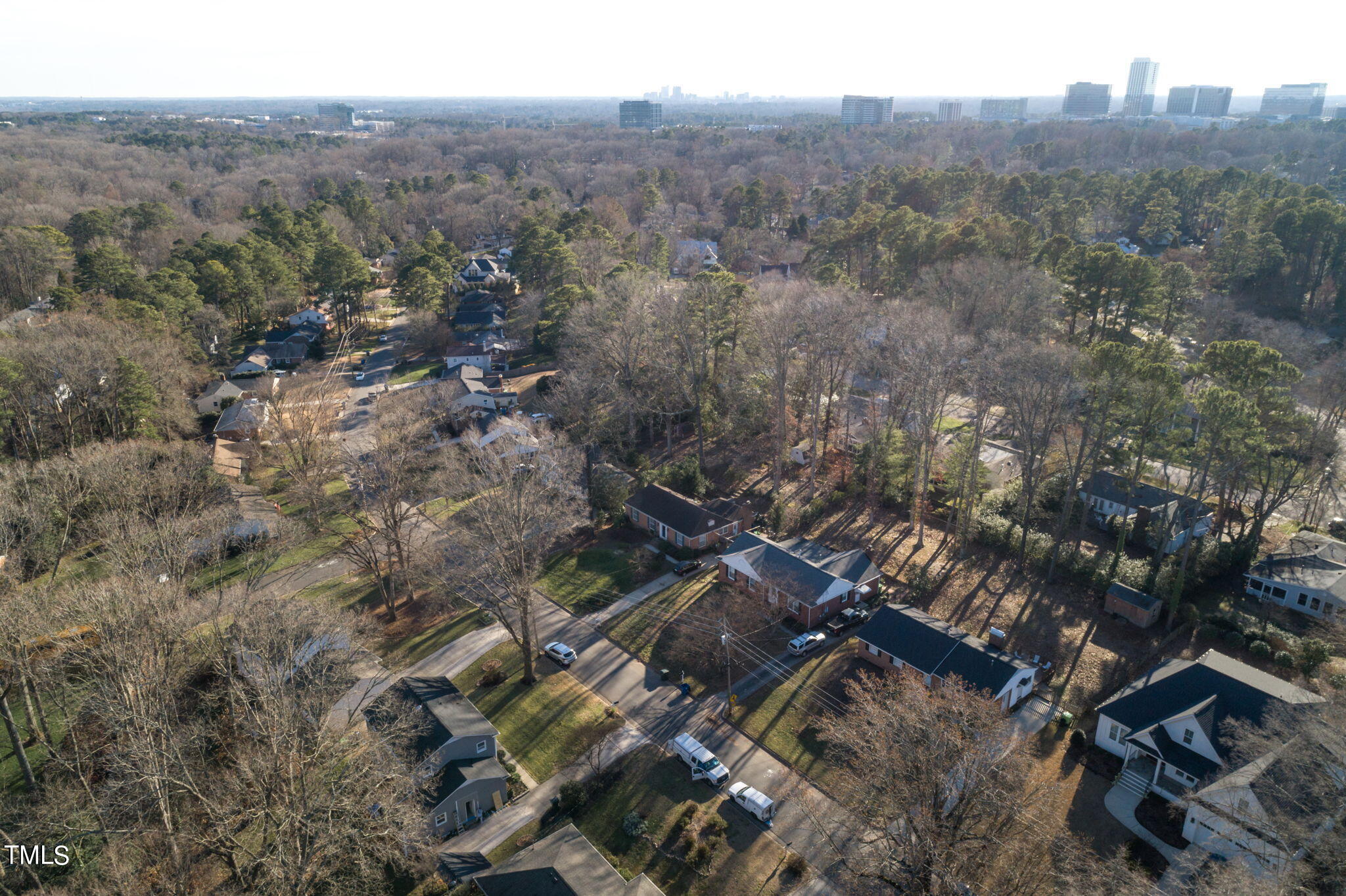 4904 Latimer Road Raleigh, NC 27609 - Photo 32 of 33 an aerial view of house with yard and mountain view in back