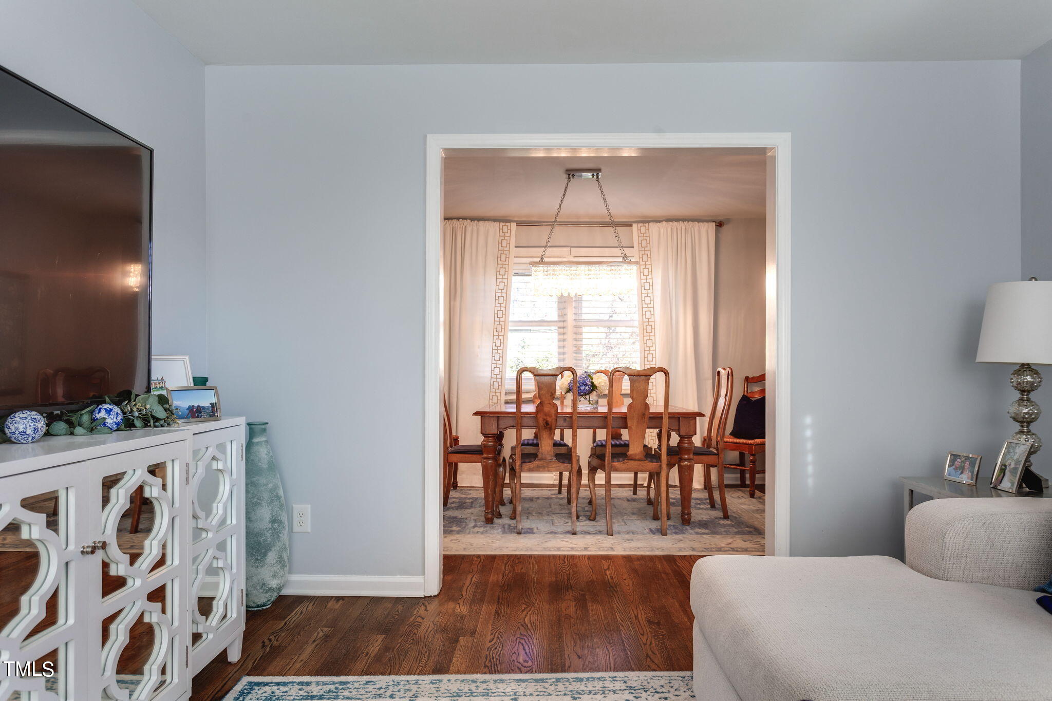 4904 Latimer Road Raleigh, NC 27609 - Photo 9 of 33 a living room with furniture and a wooden floor