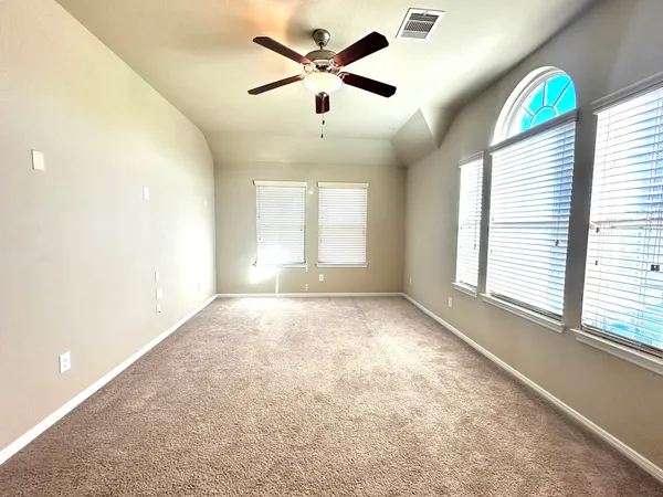 a view of garden with wooden fence