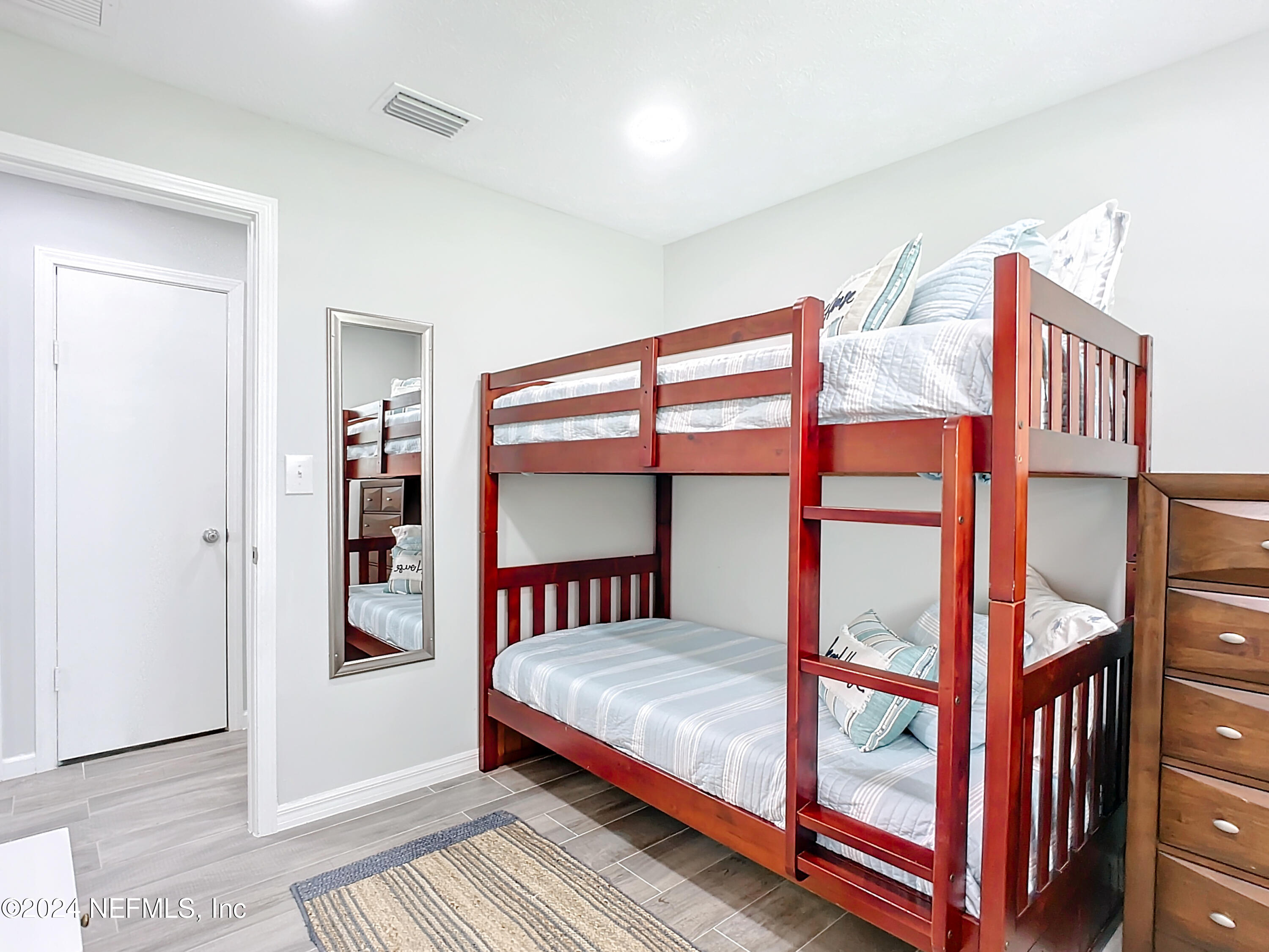 54 Surf Drive St. Augustine, FL 32080 - Photo 22 of 47 a bedroom with a bed and a window