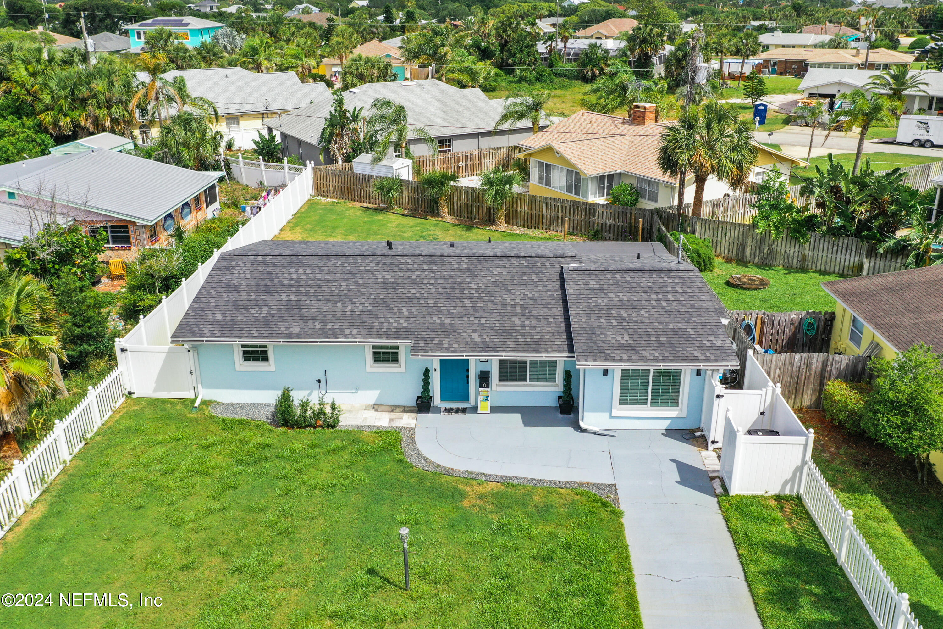 54 Surf Drive St. Augustine, FL 32080 - Photo 36 of 47 a front view of house with yard and green space