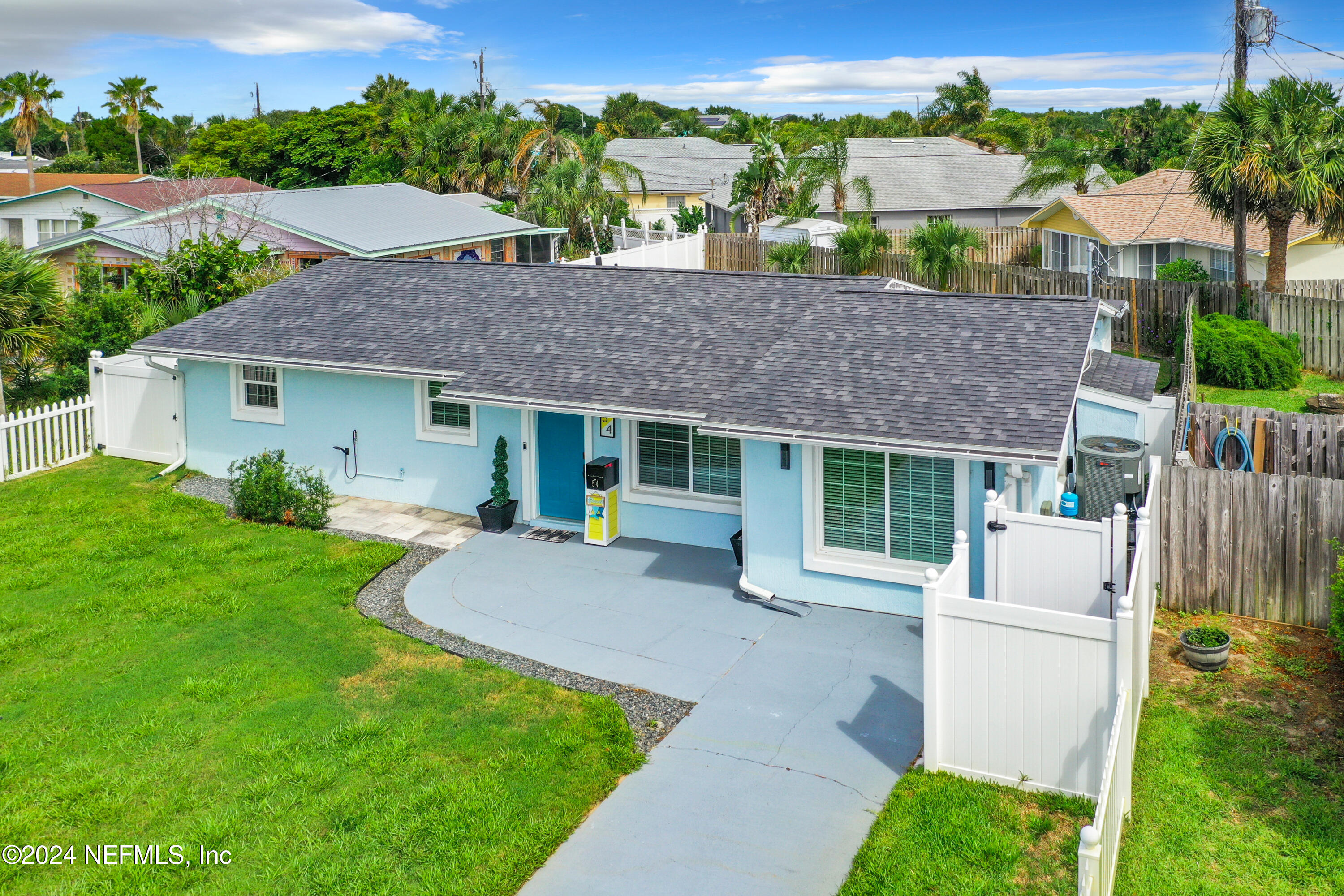 54 Surf Drive St. Augustine, FL 32080 - Photo 46 of 47 a house view with a garden space