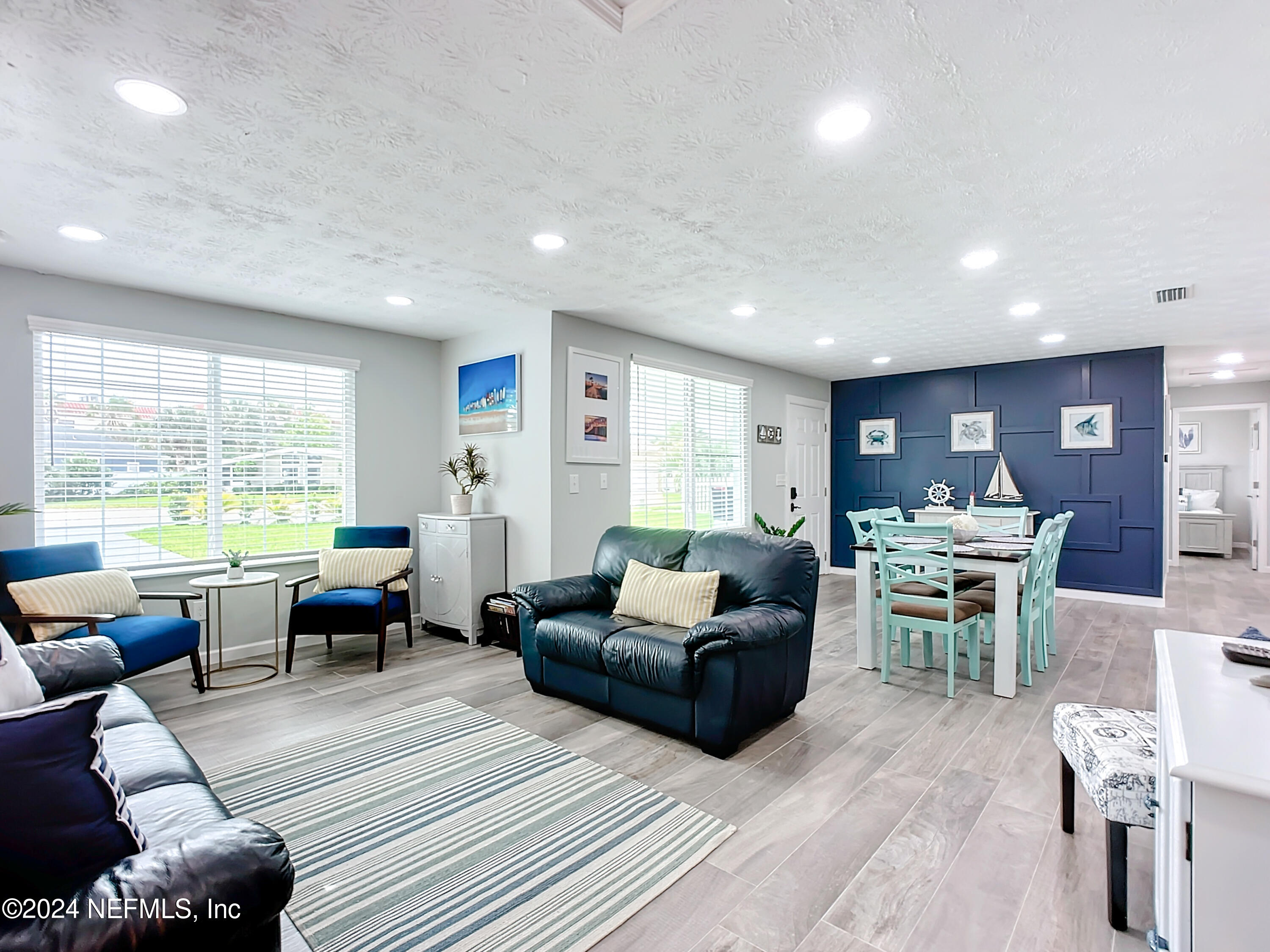 54 Surf Drive St. Augustine, FL 32080 - Photo 7 of 47 a living room with furniture and a large window