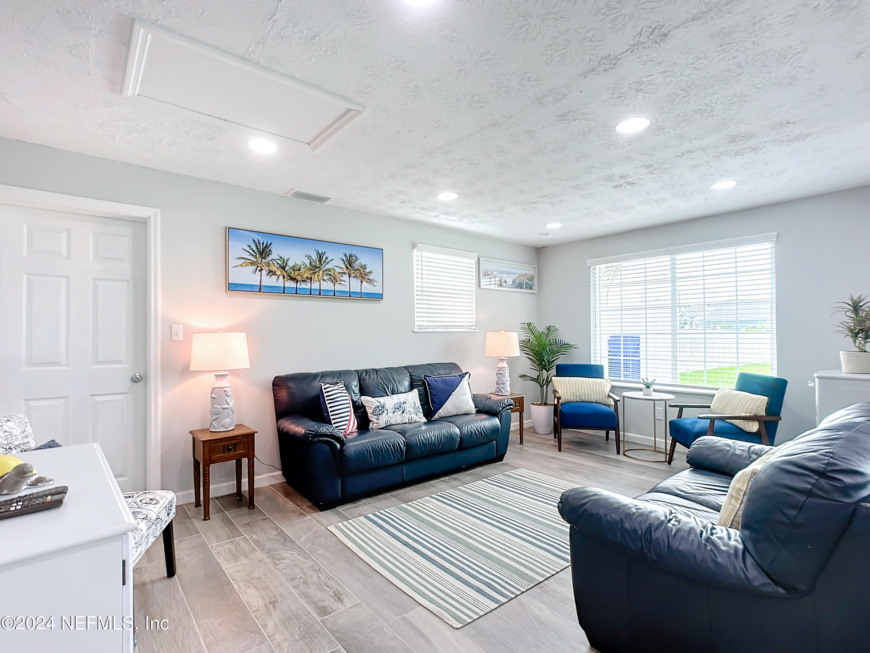 54 Surf Drive St. Augustine, FL 32080 - Photo 8 of 47 a living room with furniture and a large window