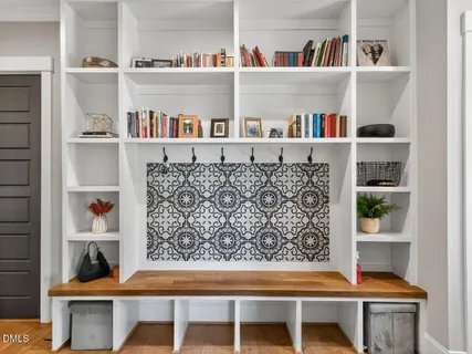 a bedroom with a bed couch and a window