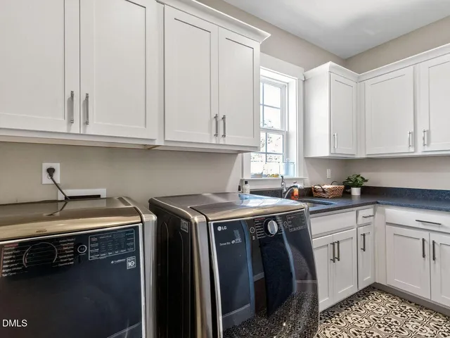 a kitchen that has a sink and cabinets