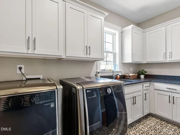 a kitchen that has a sink and cabinets