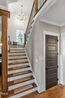 a view of entryway and hall with wooden floor