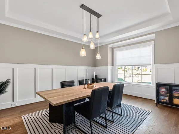 a view of a dining room with furniture window and wooden floor