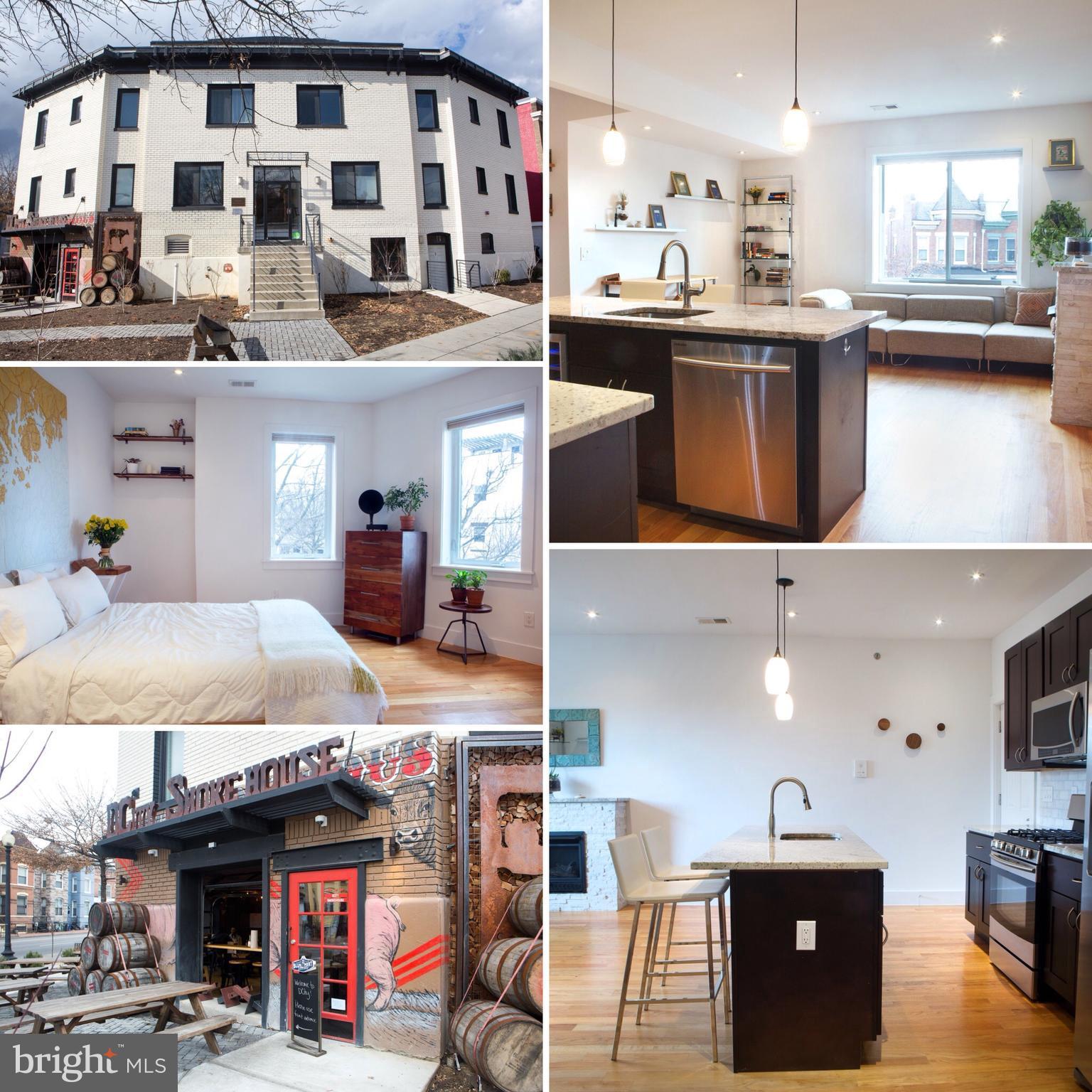 a kitchen with stainless steel appliances kitchen island granite countertop a sink and cabinets