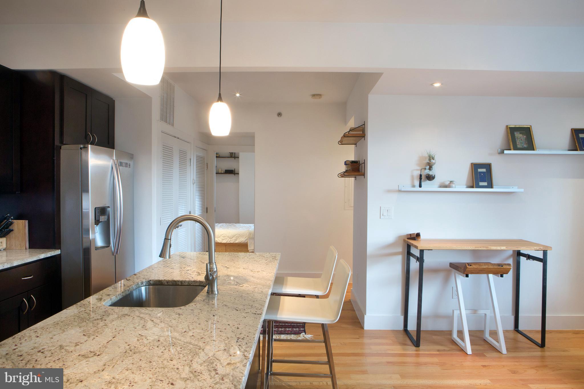 1700 2nd Street Northwest, Unit 9 Washington, DC 20001 - Photo 12 of 26 a bathroom with a sink a mirror and a shower
