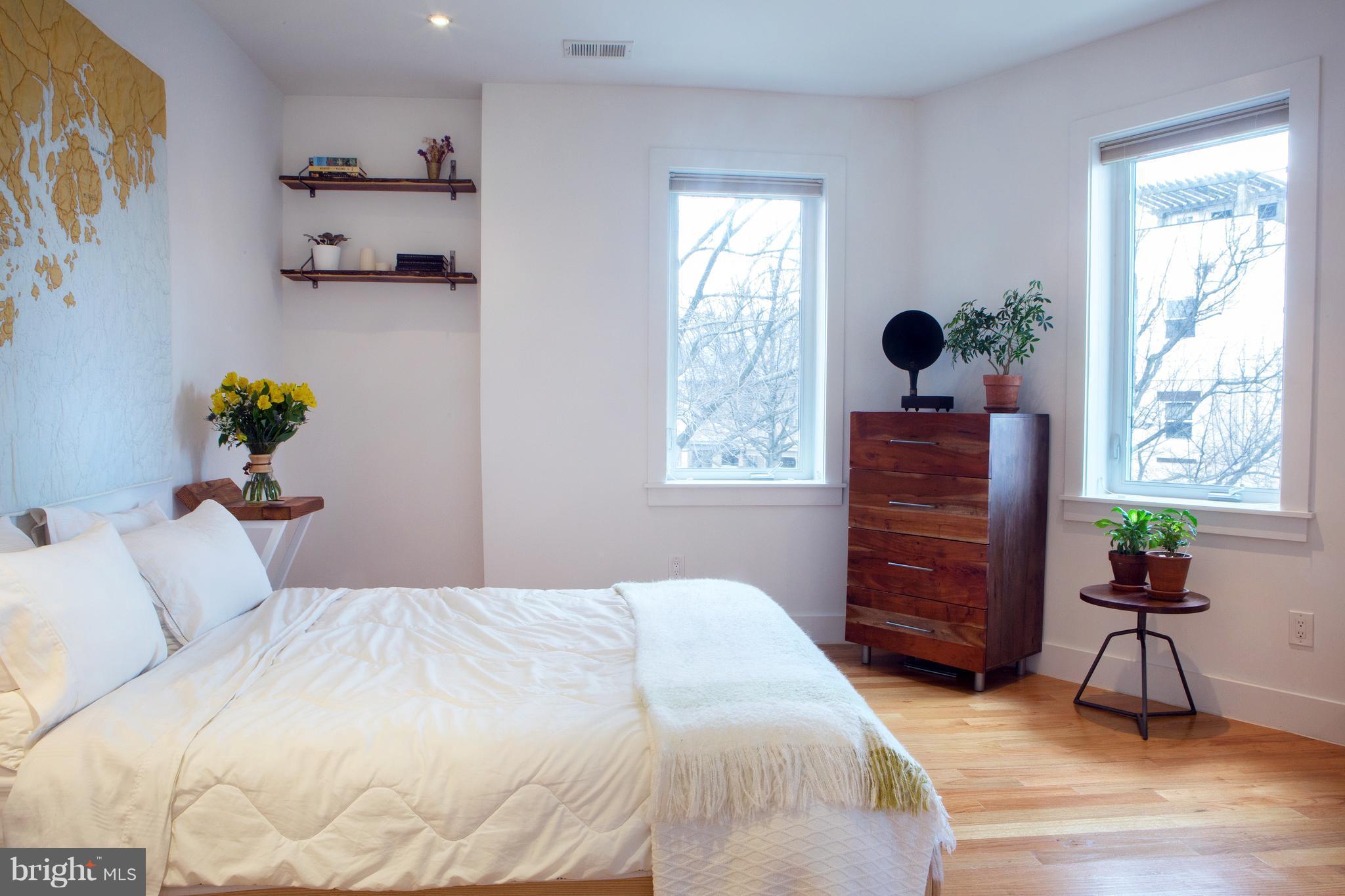 1700 2nd Street Northwest, Unit 9 Washington, DC 20001 - Photo 17 of 26 a bedroom with a bed and a window