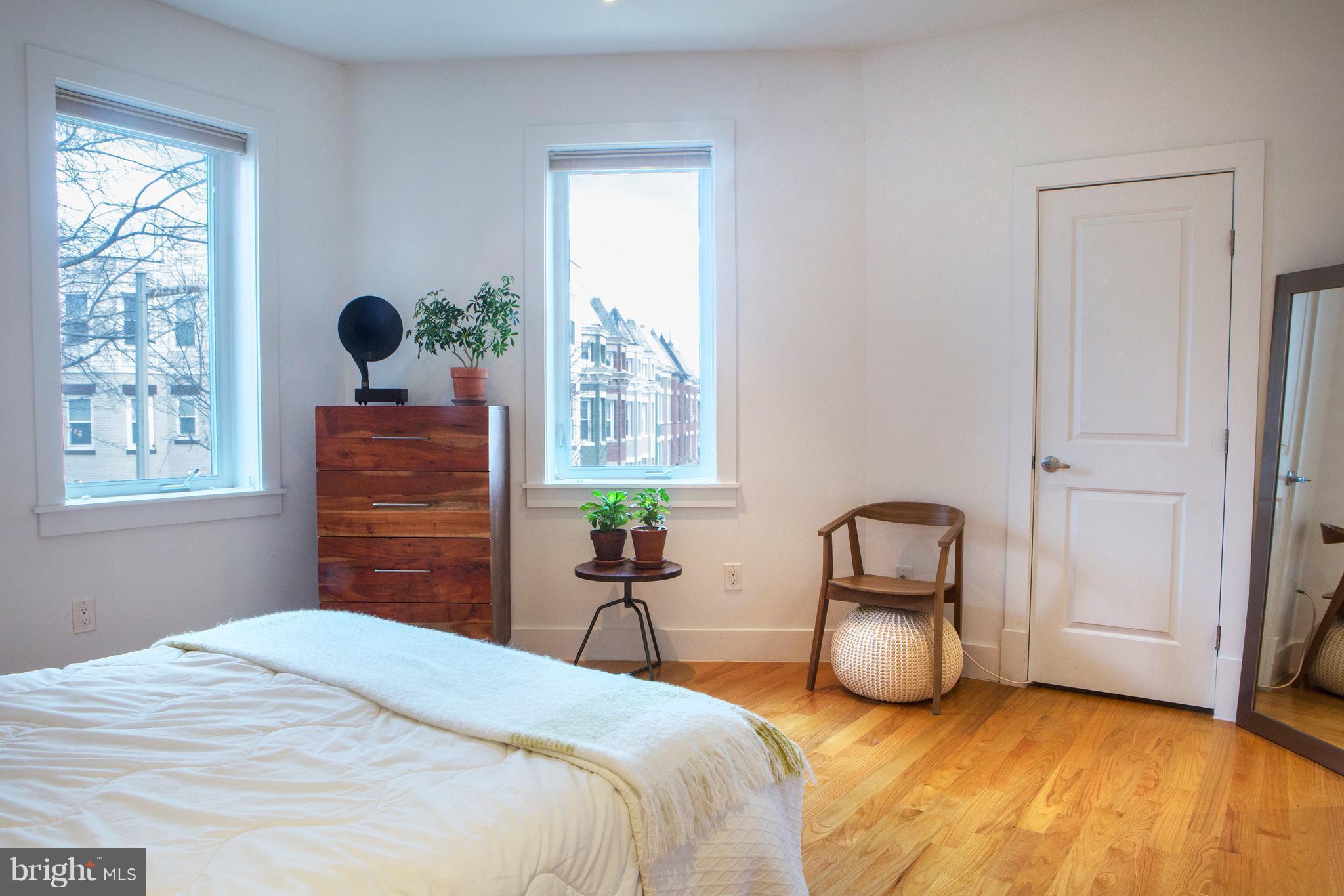 1700 2nd Street Northwest, Unit 9 Washington, DC 20001 - Photo 18 of 26 a bedroom with a bed and a window