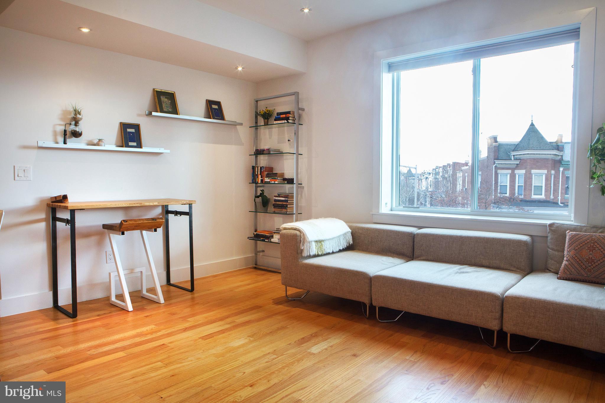 1700 2nd Street Northwest, Unit 9 Washington, DC 20001 - Photo 10 of 26 a living room with furniture and a large window