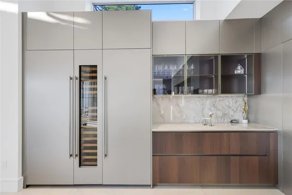 a kitchen with a refrigerator and a sink