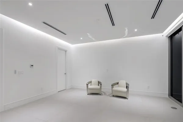 a view of a balcony with dining table and chairs with wooden floor