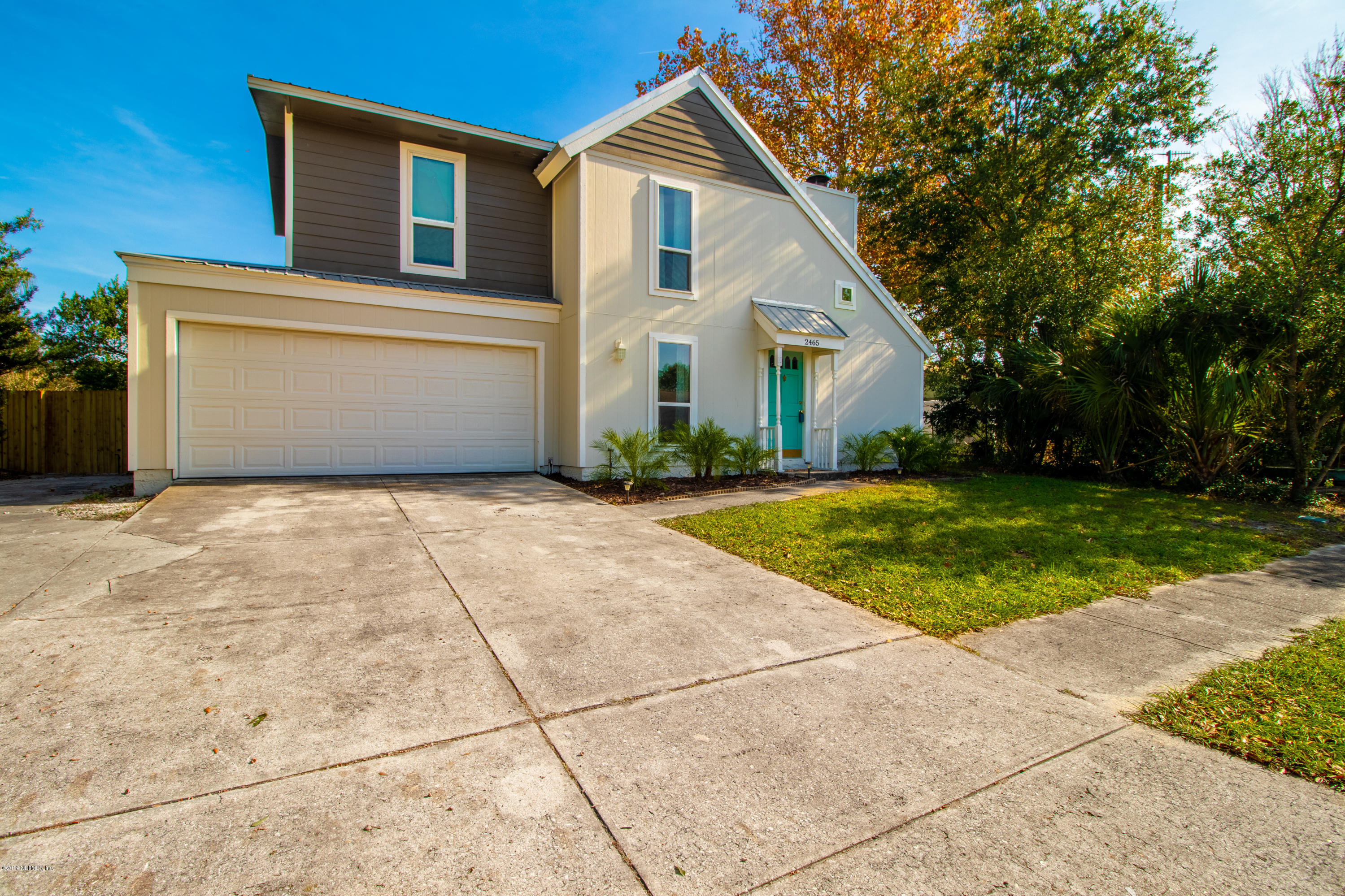 2465 Summer Tree Road East Jacksonville, FL 32246 - Photo 1 of 32 a front view of house with yard and green space