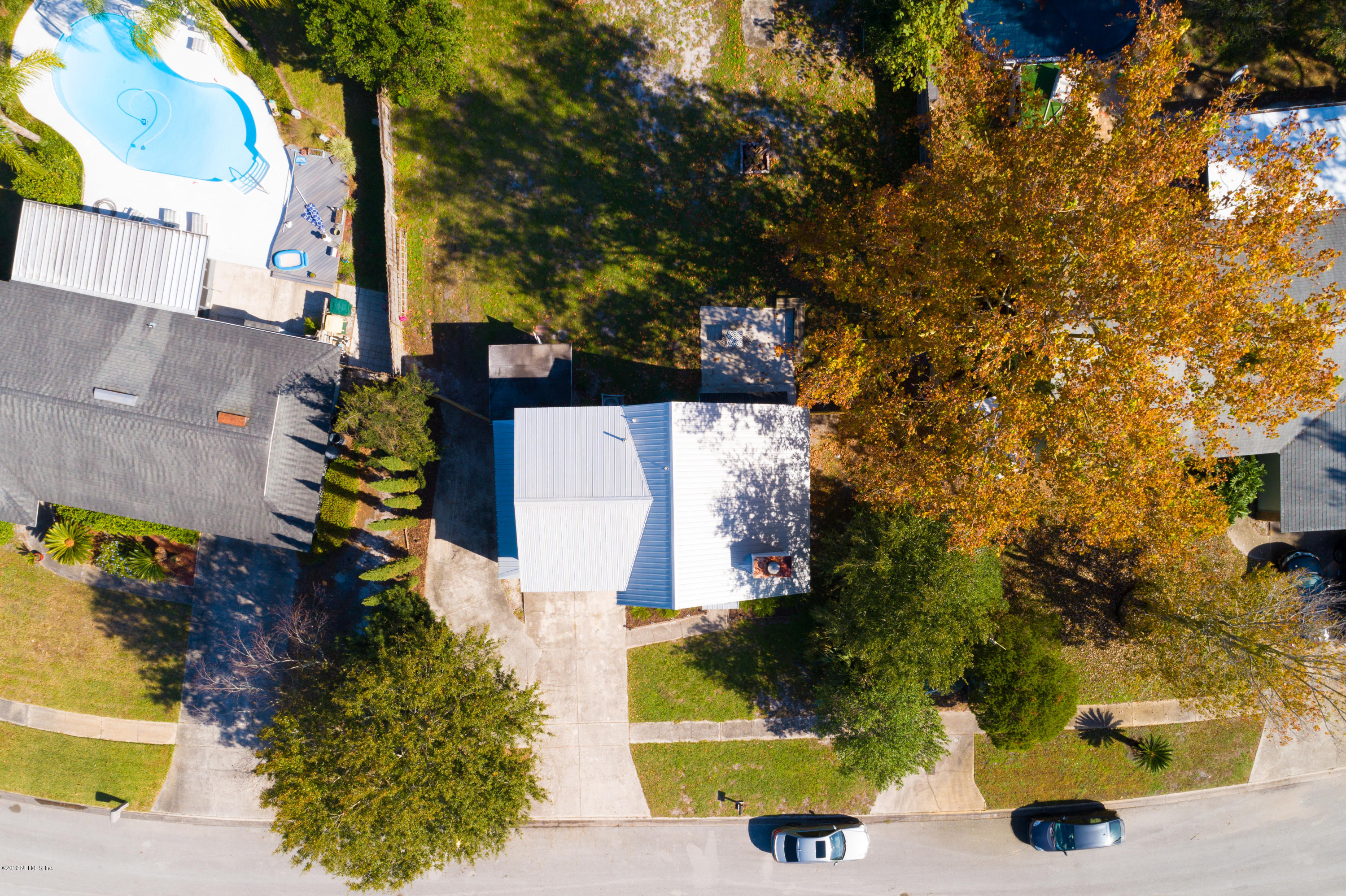 2465 Summer Tree Road East Jacksonville, FL 32246 - Photo 31 of 32 an aerial view of a house with a yard and trees