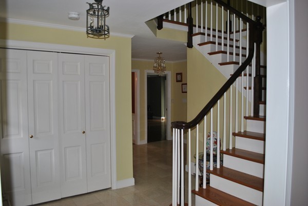 71 Yarmouth Road Wellesley, MA 02481 - Photo 16 of 21 a view of entryway with wooden floor and stairs