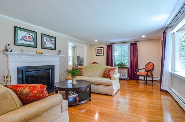71 Yarmouth Road Wellesley, MA 02481 - Photo 5 of 21 a living room with furniture and a fireplace