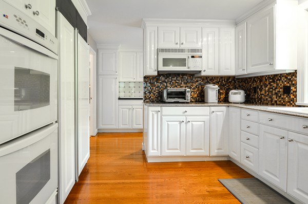 71 Yarmouth Road Wellesley, MA 02481 - Photo 10 of 21 a kitchen with white cabinets and sink