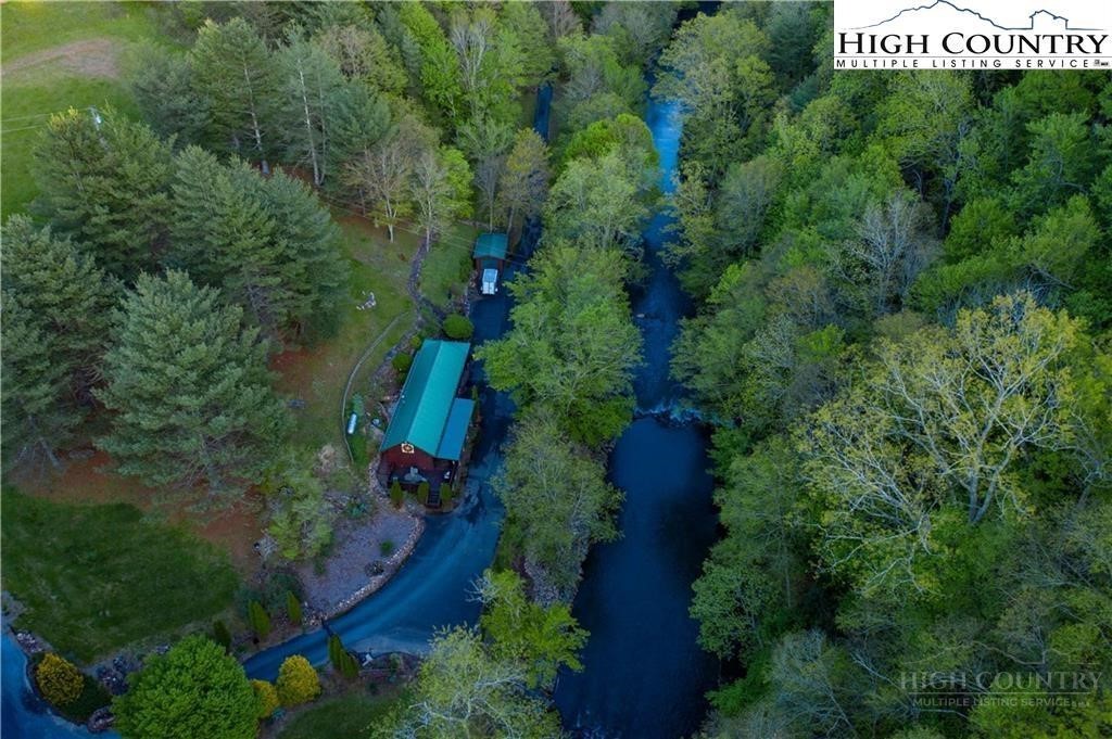 489 Buttons Lane Sparta, NC 28675 - Photo 29 of 30 an aerial view of residential house with outdoor space and trees all around
