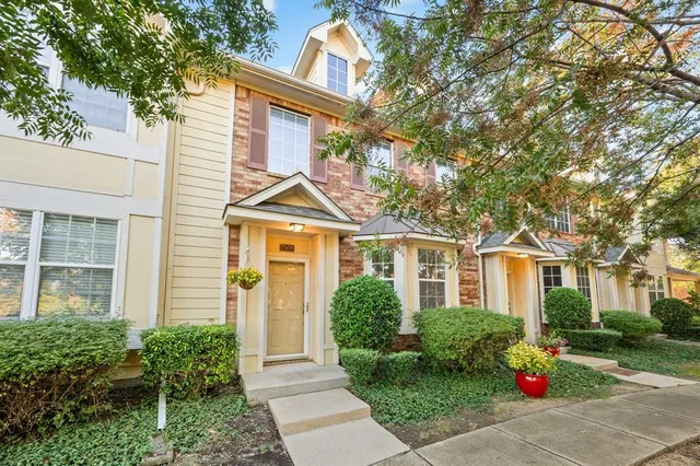 front view of a house next to a yard