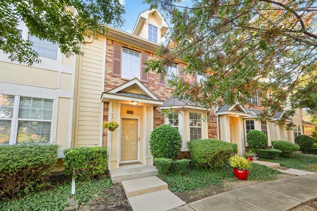 front view of a house next to a yard