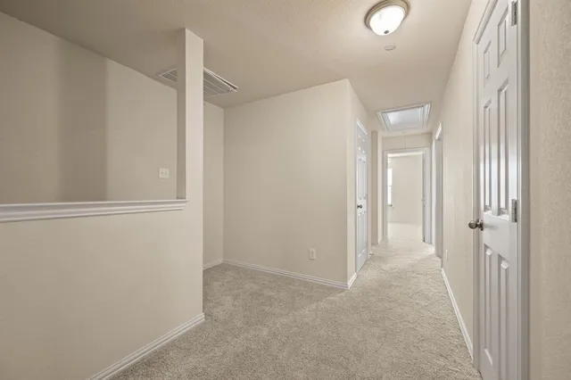 a view of a hallway with closet area