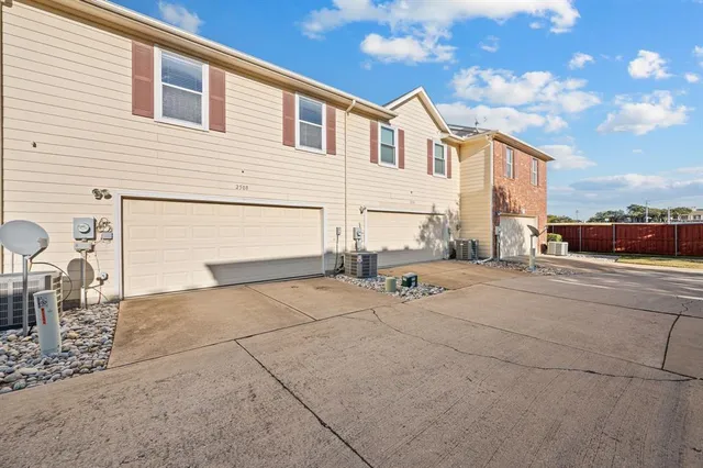 a view of a yard with a house and large trees