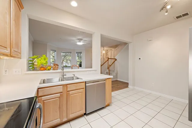 a kitchen with a sink and cabinets