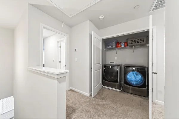 a view of entryway with washer and dryer