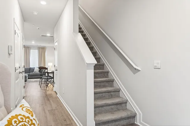 a view of entryway and dining room with furniture