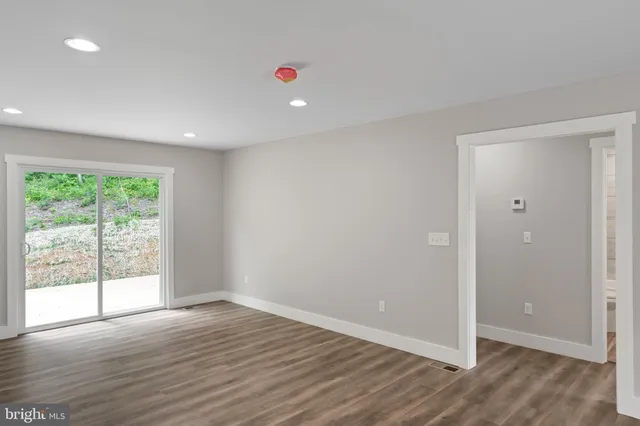 a kitchen with stainless steel appliances granite countertop a refrigerator stove and microwave