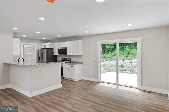a kitchen with a sink and a window