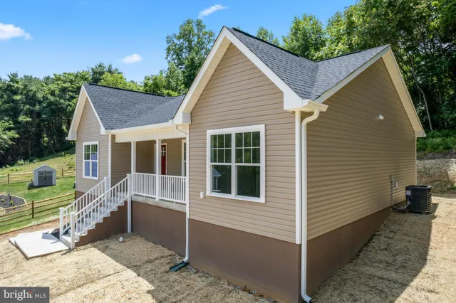 a house with trees in the background