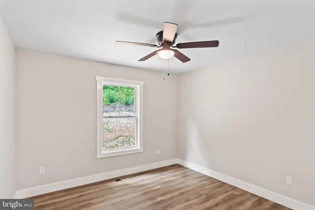 an aerial view of a house with yard