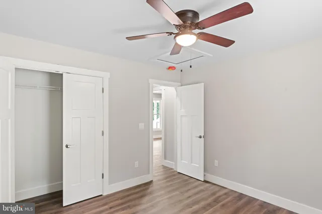 an aerial view of a house with garden space and street view