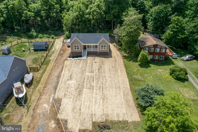 an aerial view of a house with a garden