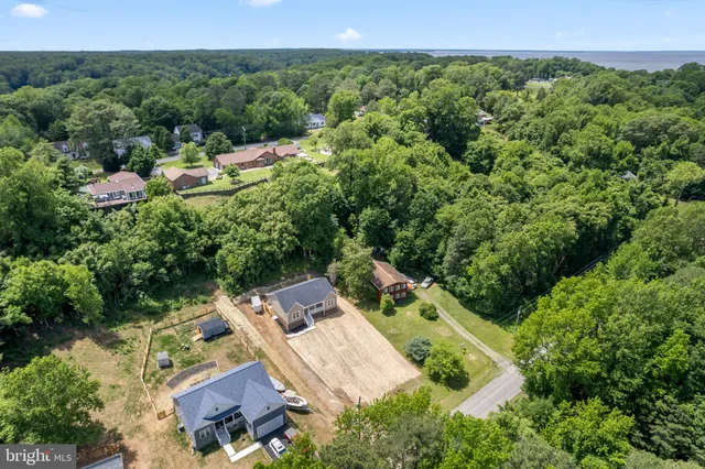 a view of a backyard with sitting area
