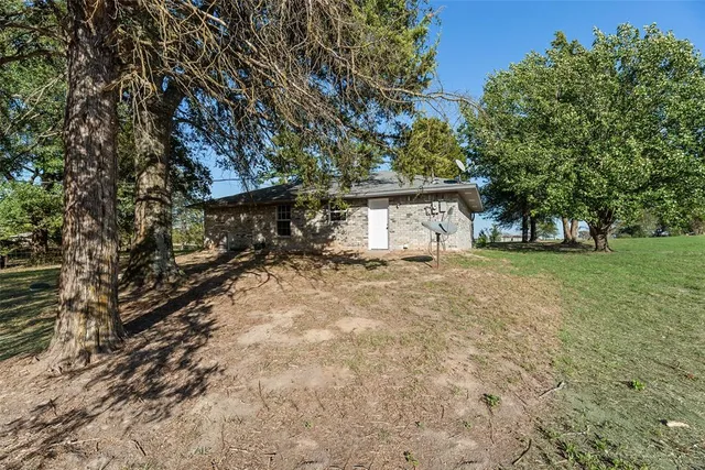 a house with trees in front of it