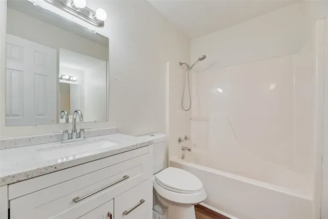 a bathroom with a sink a toilet and a bathtub