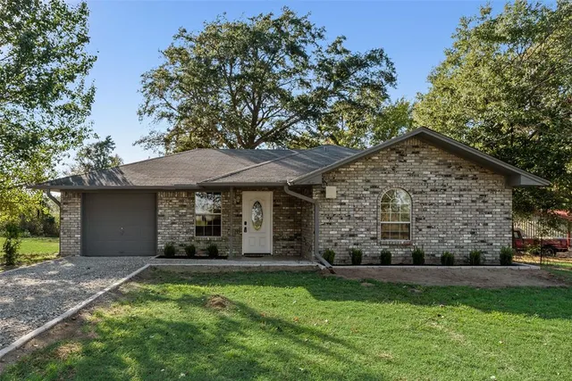 front view of a house with a yard