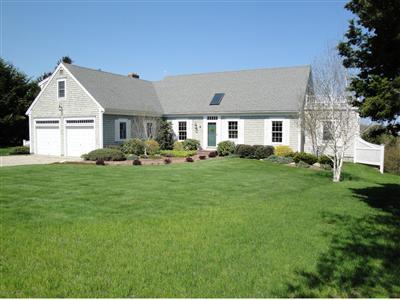 43 Ruggles Road Orleans, MA 02653 - Photo 1 of 22 a front view of house with yard and green space