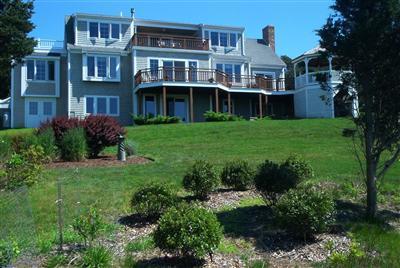 43 Ruggles Road Orleans, MA 02653 - Photo 3 of 22 a front view of a house with a yard and potted plants