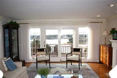 43 Ruggles Road Orleans, MA 02653 - Photo 4 of 22 a living room with furniture and a floor to ceiling window