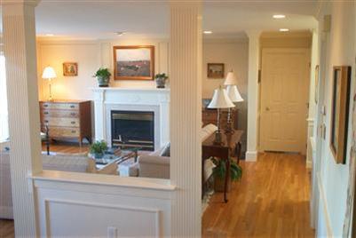 43 Ruggles Road Orleans, MA 02653 - Photo 6 of 22 a living room with furniture and a fireplace