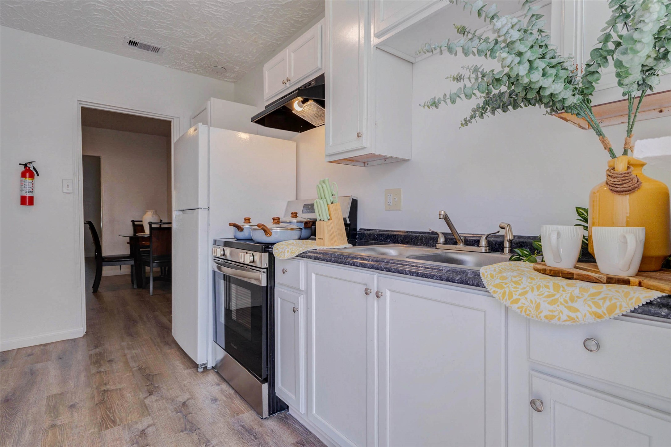 2902 Truxillo Street Houston, TX 77004 - Photo 26 of 32 a kitchen with a sink and cabinets