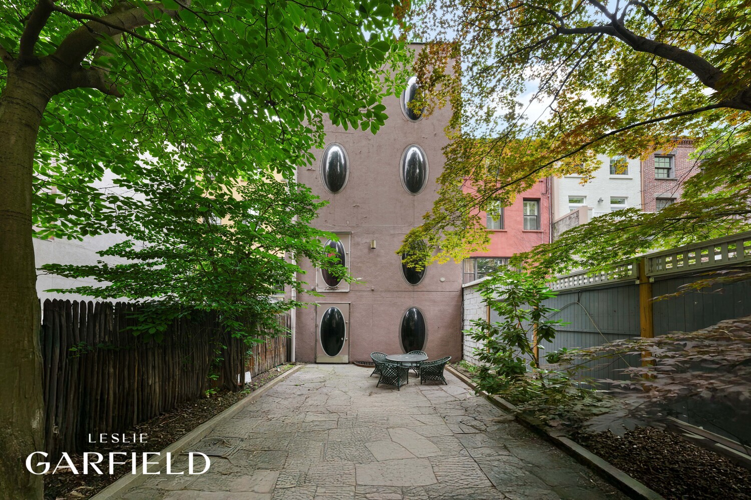 251 East 71st Street Manhattan, NY 10021 - Photo 9 of 10 a view of a house with a garden