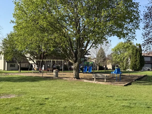 a view of a park with swings